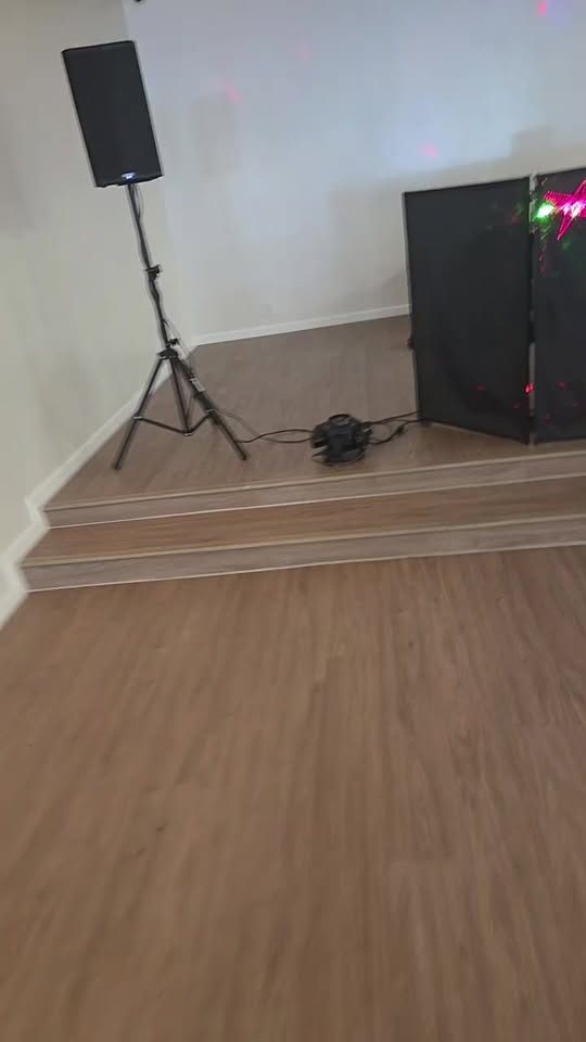 DJ EZ ED setup with speaker and lighting